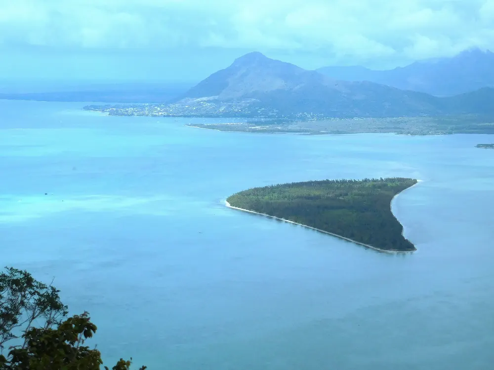 A small island in a turquoise lagoon